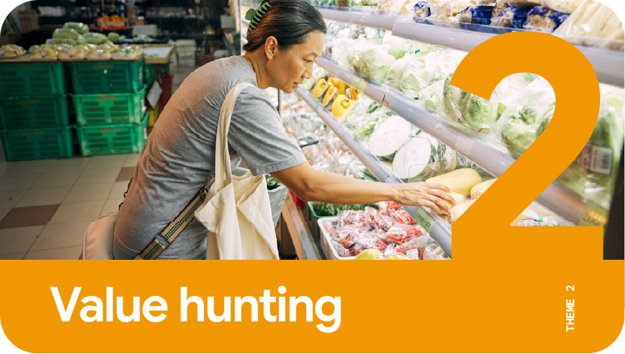 Theme 2: Value hunting. A middle-aged woman grocery shopping in the supermarket, looking through the options in the vegetable section to make a purchase decision with the best value overall.