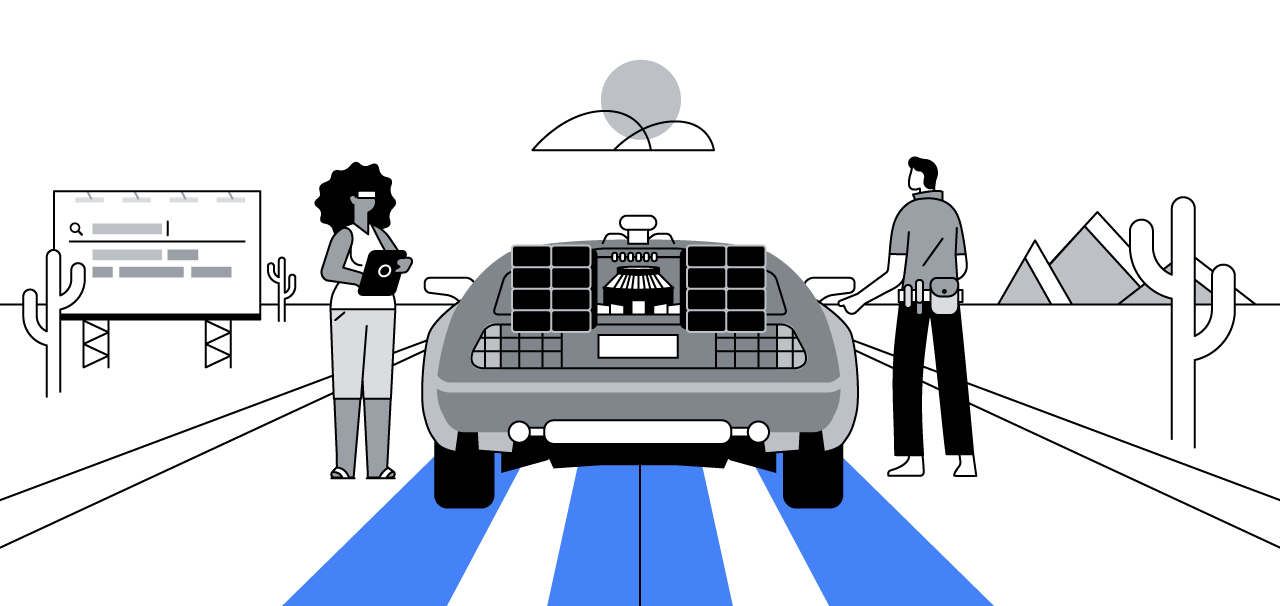 A woman with dark curly hair and a man with short hair are in the desert. They stand next to the car from “Back to the Future”, which looks to be powered by AI.
