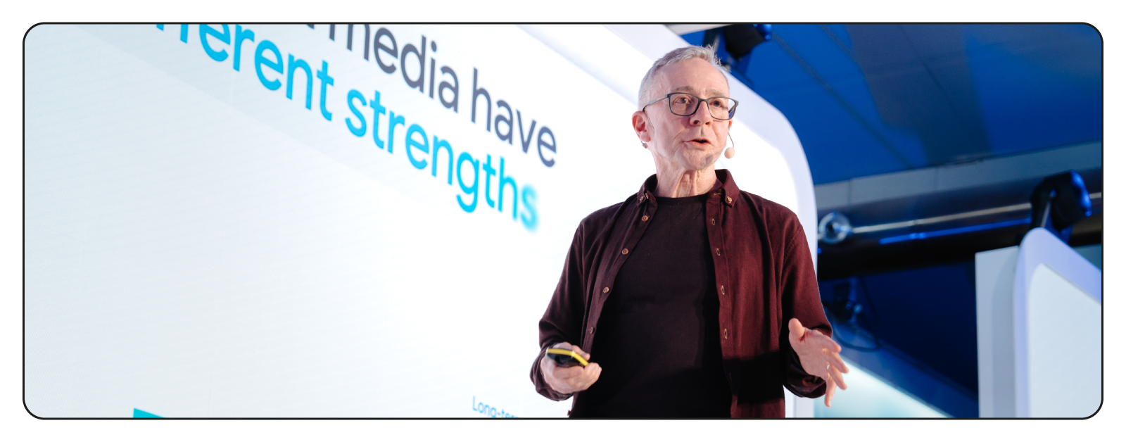A photo of Les Binet on stage, speaking at the Think 2025 event in Stockholm.