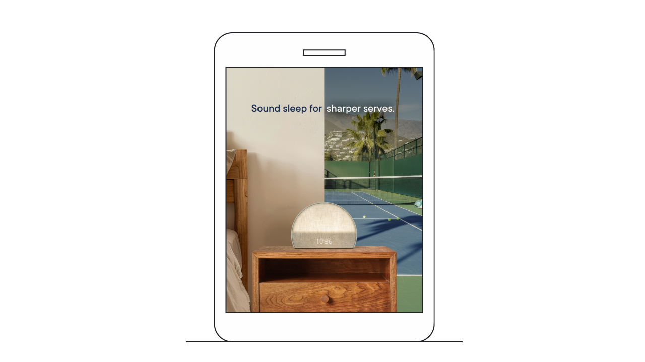 Mock up of a tablet shows an ad for a 3/4-moon-shaped alarm clock on a bedside table. The background is split between the bedroom wall and a tennis court. A tagline reads “Sound sleep for sharper serves.”