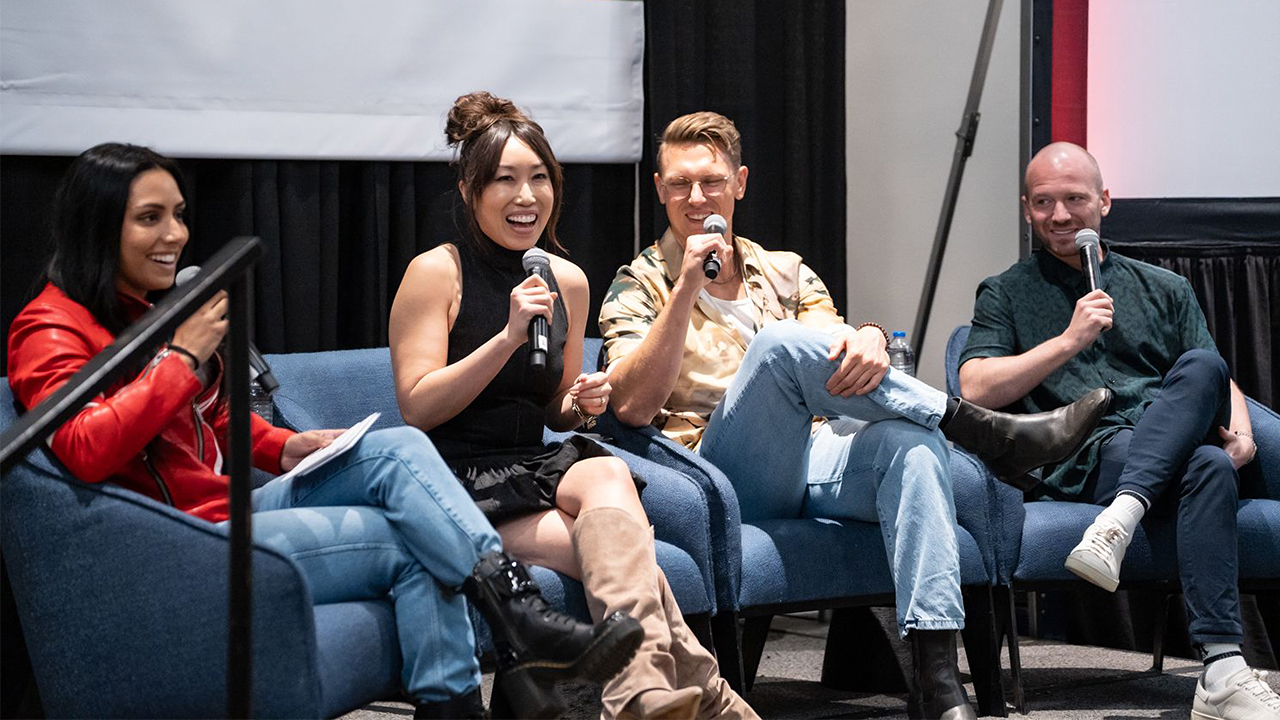 Pictured (left to right) are YouTube creators Michelle Khare, Cassey Ho, Josh Scherer, and Sean Evans sitting in blue armchairs while speaking into handheld microphones at an SXSW event.
