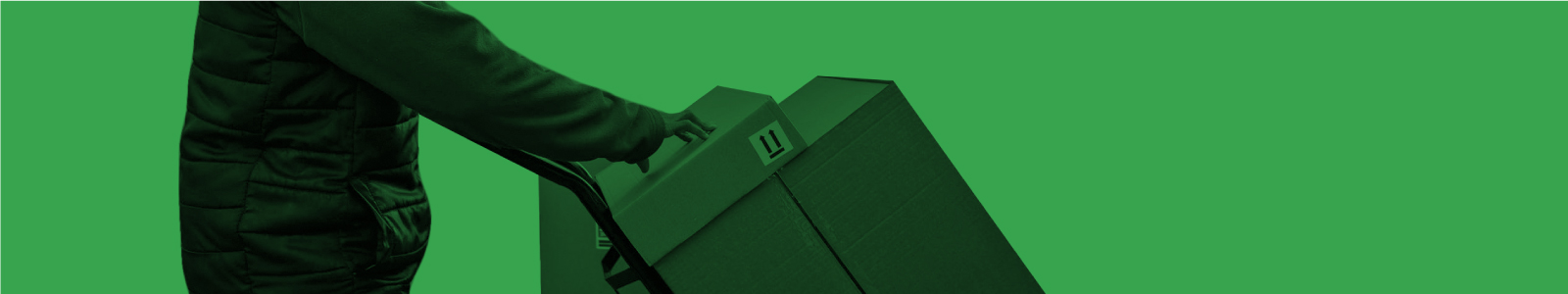 A man carrying returns in cardboard boxes